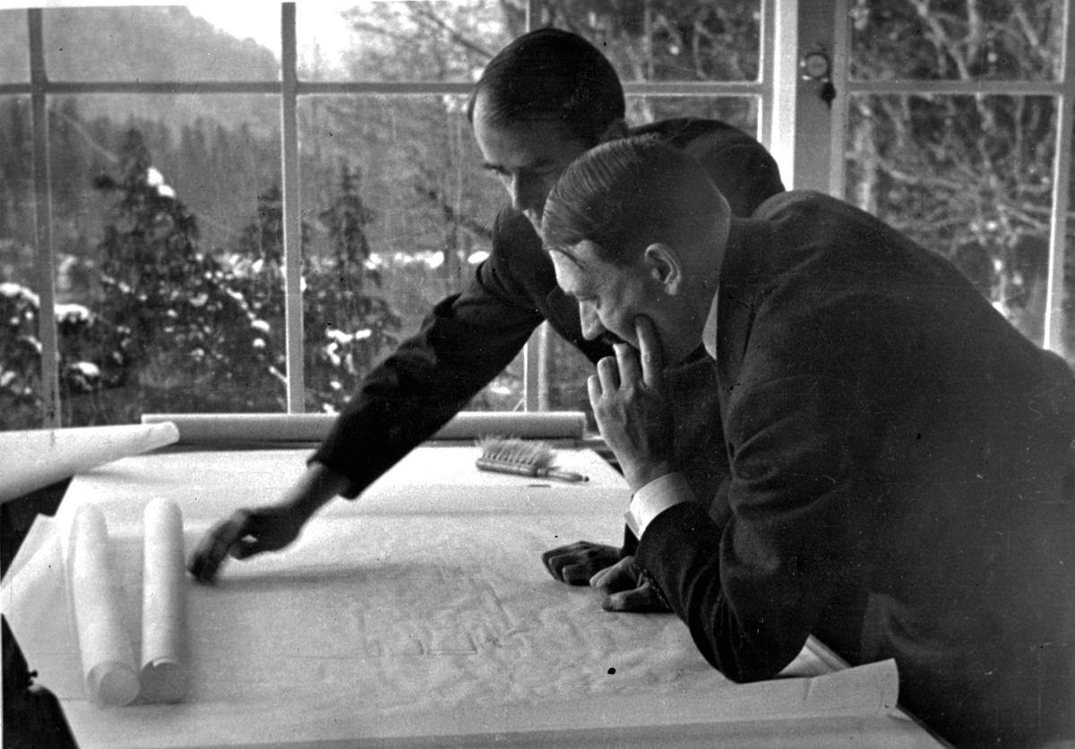 Adolf Hitler and Albert Speer working on architectural plans in Bechstein house on the Obersalzberg , from Eva Braun's albums